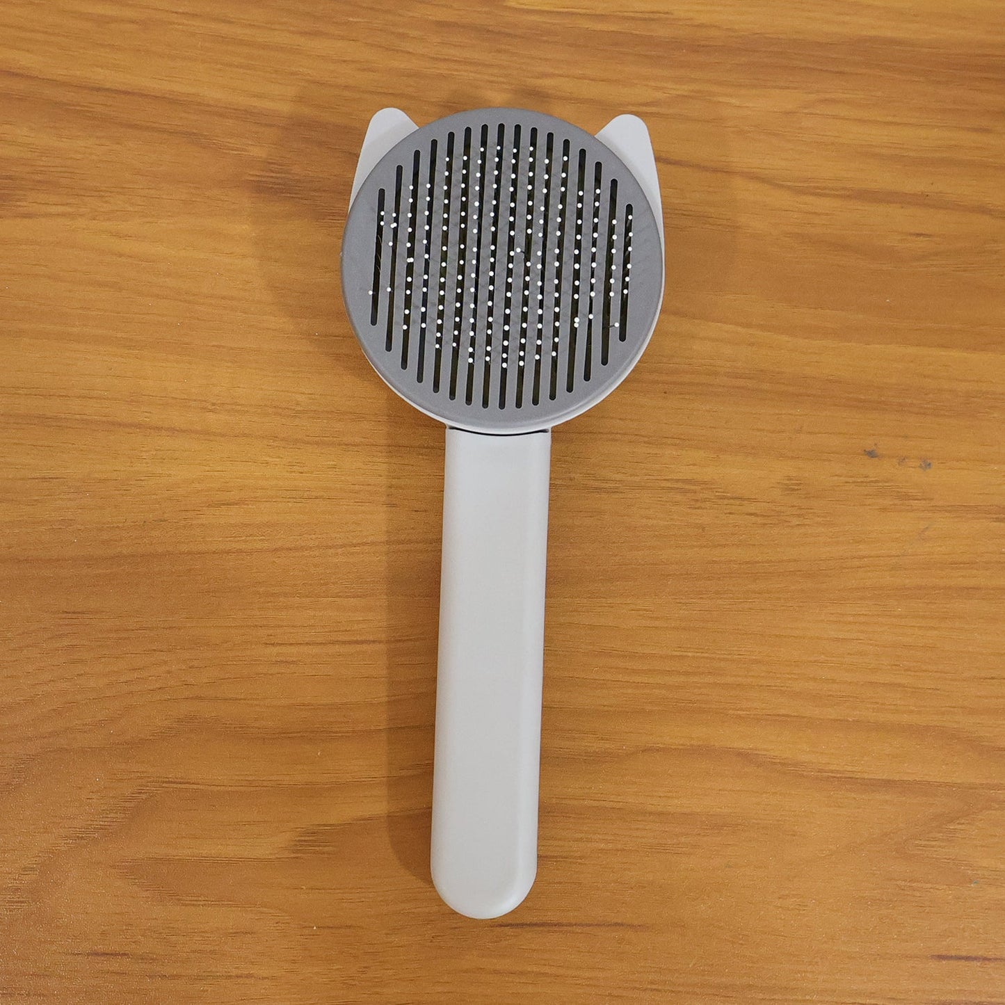 Reusable pet shedding needle comb