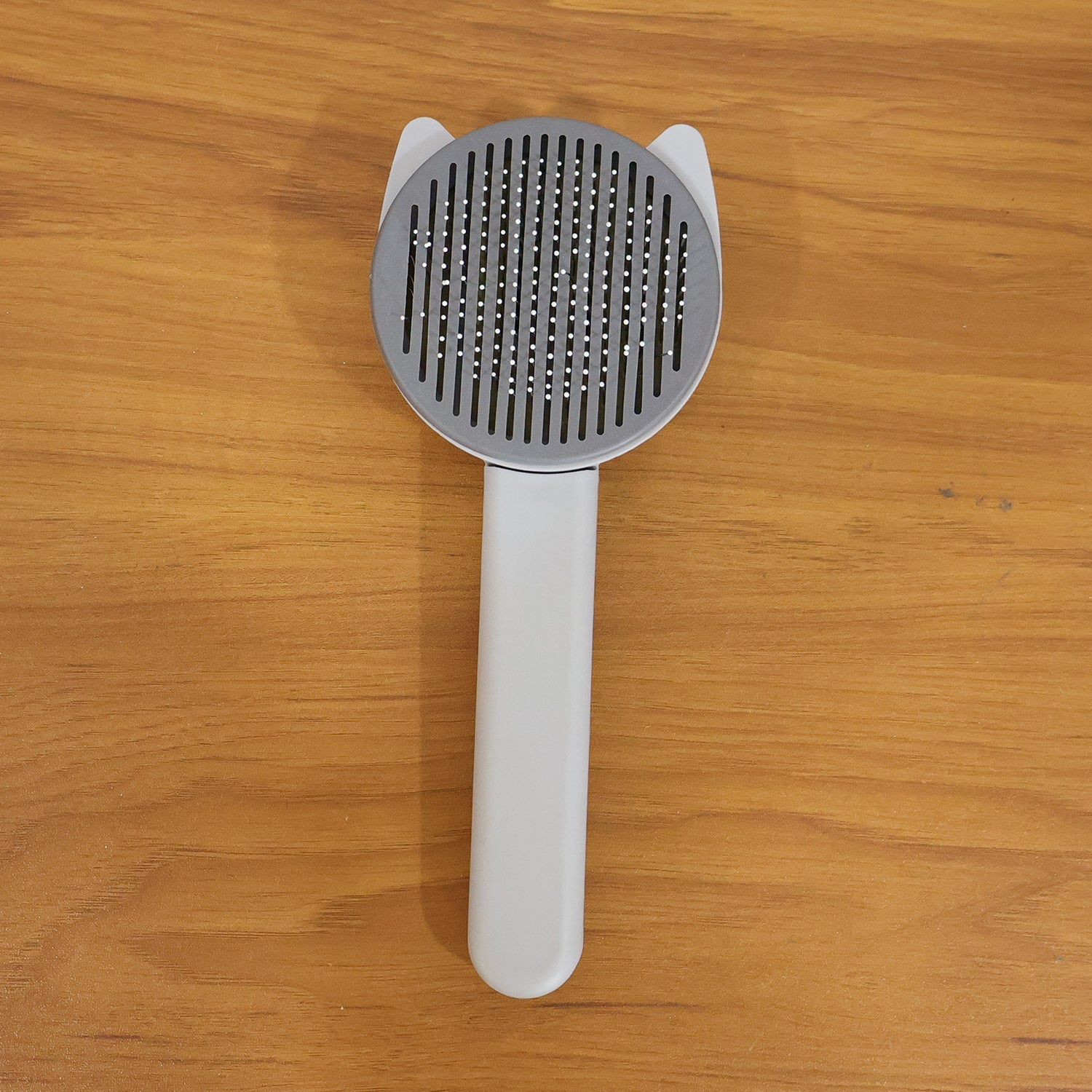 Reusable pet shedding needle comb